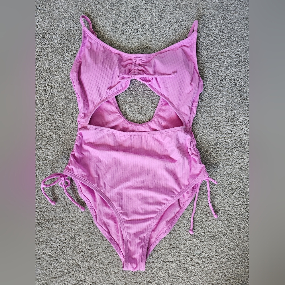 California Wave one-piece swimsuit. Pinkish purple in color. Size Large.